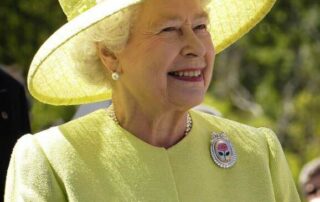 Queen Elizabeth II smiling in Yellow